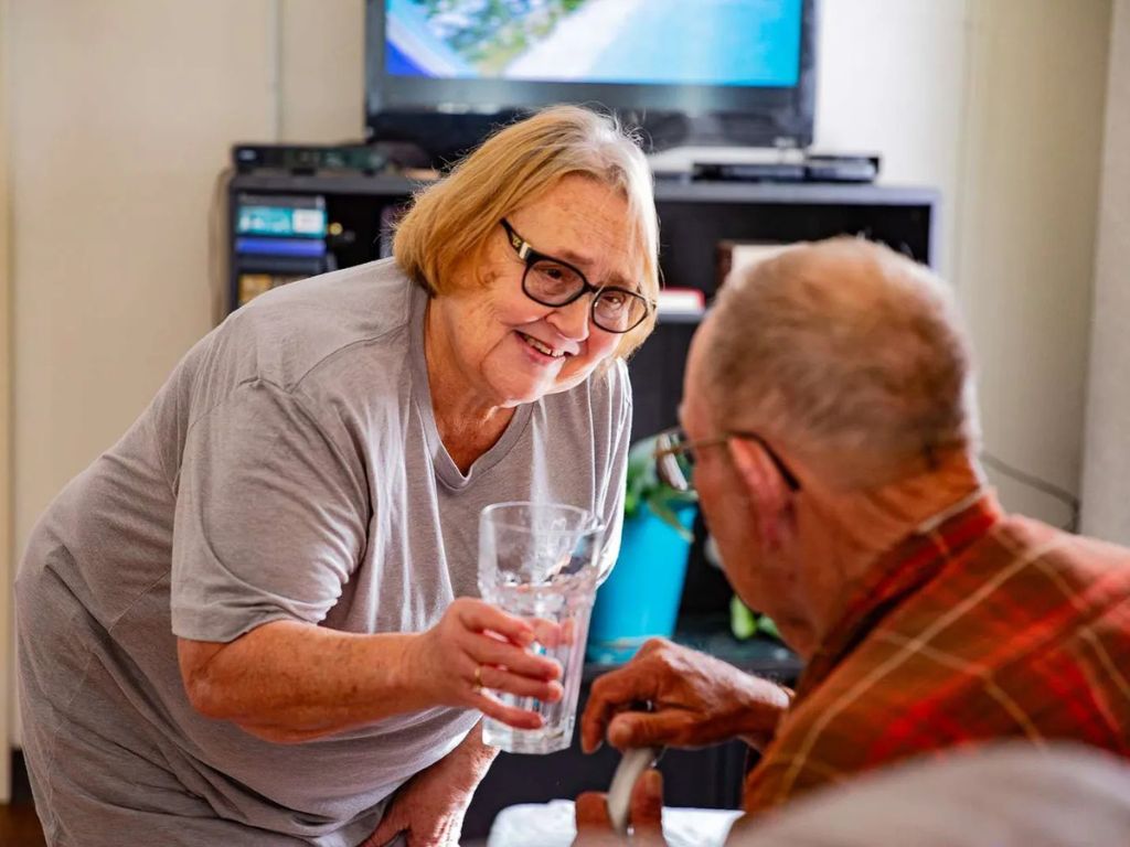 caregiver assisting senior who experienced a traumatic brain injury caregiver assisting senior who experienced a traumatic brain injury