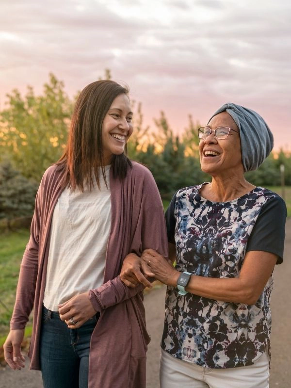 caregiver walking outside with a senior