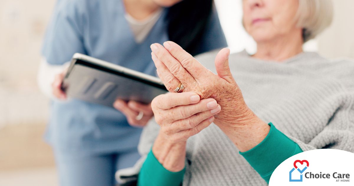 A caregiver provides in home care services to a senior with arthritis