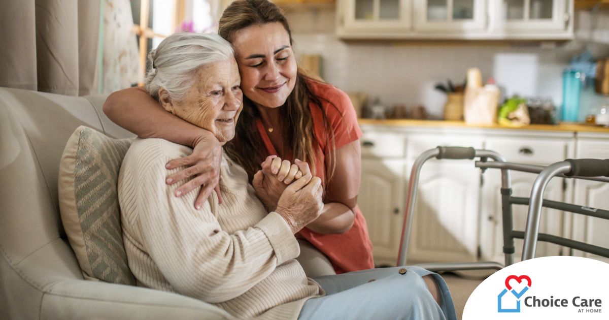 Caregiver supporting an elderly woman in the transition to senior home care