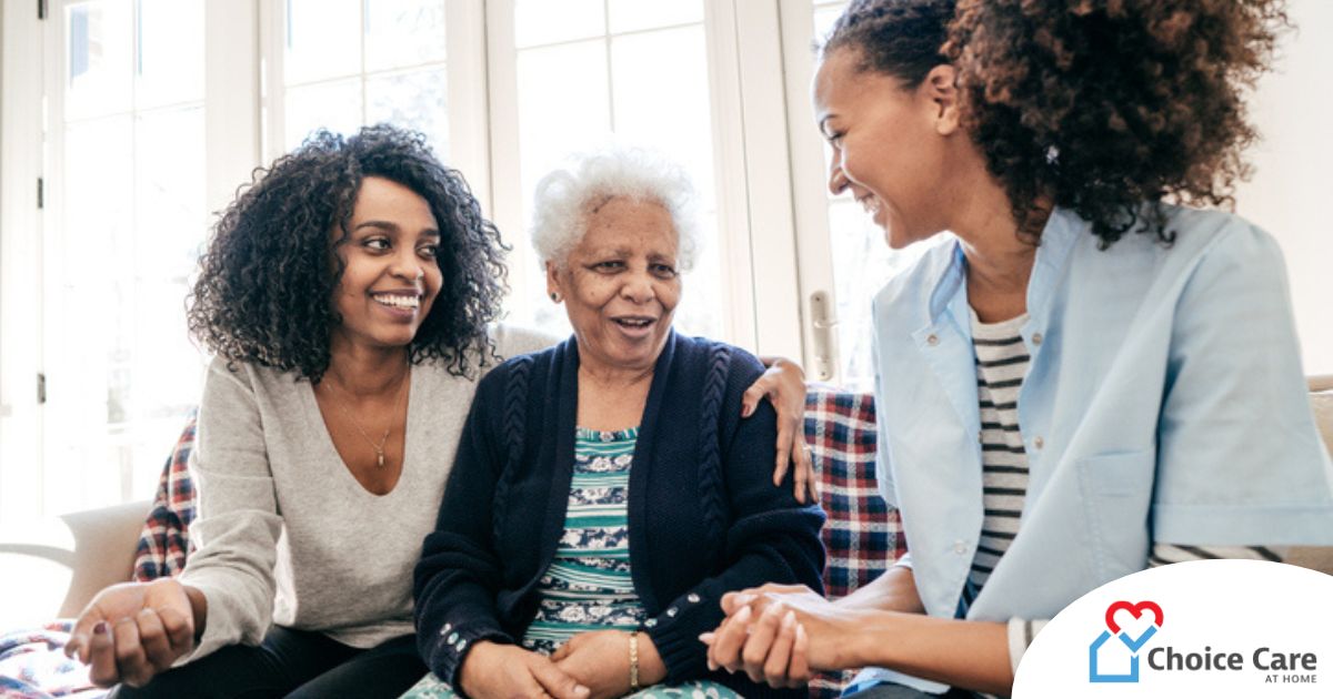 Caregiver talking to a family about Elderly Care