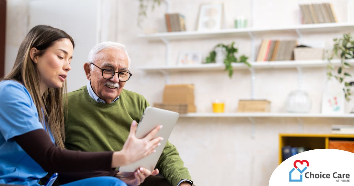 Home caregiver assisting senior man to use telehealth and senior care