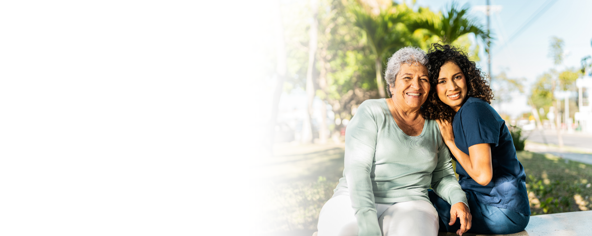caregiver and senior woman embracing on sunny patio – Home Care in Cabell County, WV caregiver and senior woman embracing on sunny patio - Home Care in Cabell County, WV